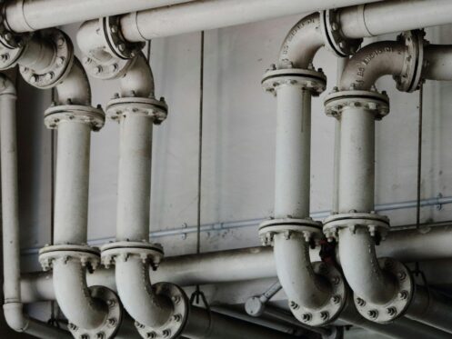 A professional works on industrial pipes for Davenport plumbing services