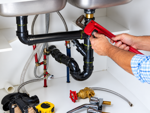 An Auburndale plumber fixing drainage issues in a sink