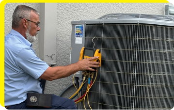 An hvac technician working on a unit