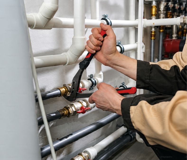 HVAC technician inspecting an air conditioning system for local home-service customers