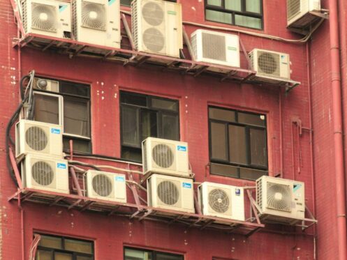 Multiple outdoor air conditioning units mounted on a building illustrate the need for reliable air conditioning repair in Lakeland.