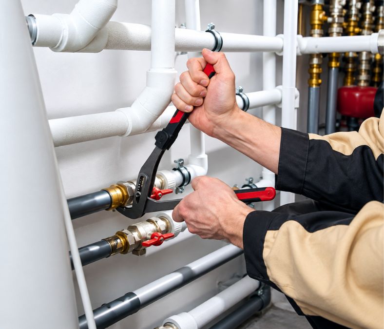 Plumbers in Lakeland, FL inspecting a residential plumbing system