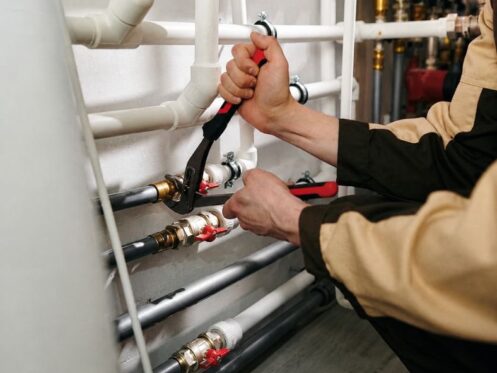 plumbers in Lakeland, FL repairing malfunctioning piping system